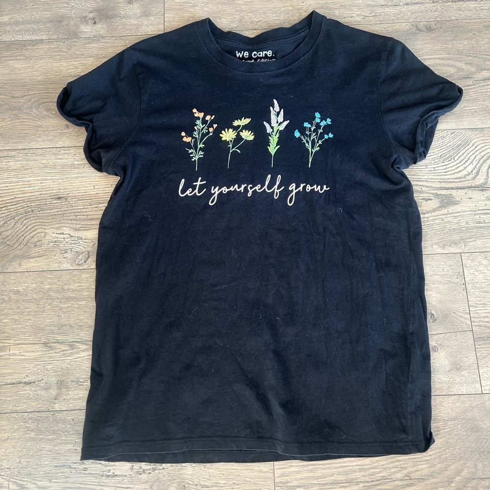 We Care “Let Yourself Grow” Black T-Shirt with Floral Design